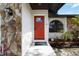 Close up of the front door with stone details, showing Ring doorbell and manicured landscape at 2477 Wood Oak Dr, Sarasota, FL 34232