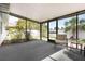 Enclosed lanai featuring an outdoor ceiling, neutral carpet, and seating at 2477 Wood Oak Dr, Sarasota, FL 34232
