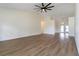 Bright living room with vaulted ceilings and wood-look flooring at 2477 Wood Oak Dr, Sarasota, FL 34232