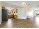 Open-concept living room flows into the kitchen with wood cabinets and stainless steel appliances at 2477 Wood Oak Dr, Sarasota, FL 34232