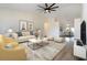 Bright living room with vaulted ceilings, neutral furniture, and wood-look floors at 2477 Wood Oak Dr, Sarasota, FL 34232