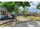 Charming backyard featuring a deck, grill, and well-maintained lawn at 2509 8Th W Ave, Bradenton, FL 34205