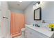 Bathroom featuring a tub and shower with a peach-patterned shower curtain at 2509 8Th W Ave, Bradenton, FL 34205