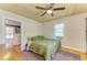 Cozy bedroom with wood-paneled ceiling, ceiling fan, and vintage rug at 2509 8Th W Ave, Bradenton, FL 34205
