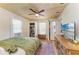 Bedroom with closet, dresser, wood ceiling and floors, and a ceiling fan at 2509 8Th W Ave, Bradenton, FL 34205