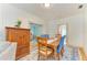 Cozy dining room with wood floors, natural light, and a dining table with blue upholstered chairs at 2509 8Th W Ave, Bradenton, FL 34205