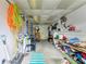 Organized garage with storage shelves, tools, and ample space for projects at 2509 8Th W Ave, Bradenton, FL 34205