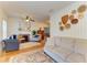 Spacious living room featuring a fireplace, ceiling fan, comfortable seating, and stylish decor at 2509 8Th W Ave, Bradenton, FL 34205