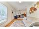 Open living room with natural light, fireplace, comfortable sofa, wood floors, and modern decor at 2509 8Th W Ave, Bradenton, FL 34205