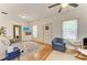 Inviting living room with wood floors, natural light, stylish furnishings, and ceiling fan at 2509 8Th W Ave, Bradenton, FL 34205