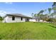 New construction backyard features lush green grass perfect for Gathering activities at 2638 Hagerick Ln, North Port, FL 34288
