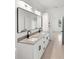 Bathroom featuring double sink vanity with modern black fixtures at 2638 Hagerick Ln, North Port, FL 34288