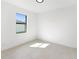 This bright bedroom features a sunny window and sleek flooring at 2638 Hagerick Ln, North Port, FL 34288