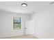Bright bedroom featuring a large window and neutral color palette at 2638 Hagerick Ln, North Port, FL 34288