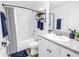 Bright bathroom featuring a shower-tub combo and vanity with modern fixtures and ample storage at 3162 27Th E Ct, Palmetto, FL 34221