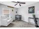 Bedroom designed with team decor, plush armchair and ceiling fan at 3162 27Th E Ct, Palmetto, FL 34221