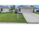 Charming single-Gathering home with a well-manicured lawn, double garage, and inviting curb appeal at 3162 27Th E Ct, Palmetto, FL 34221