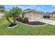 Charming single-story home featuring well-manicured lawn, flowerbeds, and a tasteful two-car garage at 3162 27Th E Ct, Palmetto, FL 34221