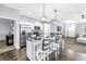 Modern kitchen with stainless steel appliances, dark countertops, barstool seating and wood flooring at 3162 27Th E Ct, Palmetto, FL 34221
