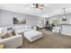 Spacious living room featuring a comfortable sectional sofa and a seamless open-concept design at 3162 27Th E Ct, Palmetto, FL 34221