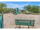 Community playground with multiple slides and play equipment in a spacious, tree-lined area at 3162 27Th E Ct, Palmetto, FL 34221