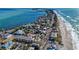 Stunning aerial view of coastal properties on Anna Maria Island with beachfront access at 3808 Cape Vista Dr, Bradenton, FL 34209