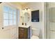 Bathroom featuring updated fixtures, vanity and tiled walk-in shower at 3808 Cape Vista Dr, Bradenton, FL 34209