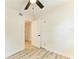 Bedroom featuring neutral walls and trim with light wood-look floors at 3808 Cape Vista Dr, Bradenton, FL 34209