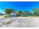 Welcome to Holmes Beach on Anna Maria Island sign with clear blue skies and lush greenery at 3808 Cape Vista Dr, Bradenton, FL 34209