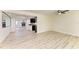 Bright, open-concept living area with wood-look floors and recessed lighting, perfect for entertaining at 3808 Cape Vista Dr, Bradenton, FL 34209