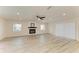 Bright open living room with recessed lighting, fireplace and view of backyard at 3808 Cape Vista Dr, Bradenton, FL 34209