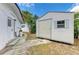 Backyard shed providing extra storage space, alongside a walkway connecting to the main house at 3808 Cape Vista Dr, Bradenton, FL 34209