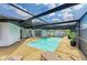 Enclosed swimming pool with lounge chairs, outdoor seating, and a patio at 3808 Cape Vista Dr, Bradenton, FL 34209