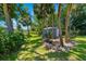 Backyard with lush grass and a storage shed, providing ample space and utility at 3988 Berlin Dr, Sarasota, FL 34233