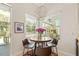 Cozy breakfast nook with a round table, chairs, and a view of the outdoors at 3988 Berlin Dr, Sarasota, FL 34233