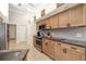 This kitchen features stainless steel appliances, light wood cabinets, and tiled backsplash at 3988 Berlin Dr, Sarasota, FL 34233