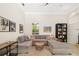 Comfortable living room with a large sectional sofa, fireplace, and TV for relaxing at 3988 Berlin Dr, Sarasota, FL 34233