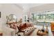 Comfortable living room with stylish seating, decor, and seamless access to the outdoor pool area at 3988 Berlin Dr, Sarasota, FL 34233