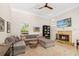 Comfortable living room with a large sectional sofa, fireplace, and TV for relaxing at 3988 Berlin Dr, Sarasota, FL 34233