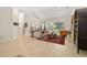 Bright living room with tile floors, neutral walls, and large windows offering ample natural light at 3988 Berlin Dr, Sarasota, FL 34233