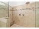 Luxurious shower with rain shower head, hand shower, and built-in bench at 3988 Berlin Dr, Sarasota, FL 34233