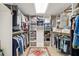 Organized walk-in closet with shelving and hanging space, offering plenty of storage at 3988 Berlin Dr, Sarasota, FL 34233