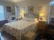 Comfortable bedroom with carpet floors, full closet, and ambient lighting at 4027 Allure Ln, North Port, FL 34287