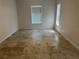 Spacious bedroom with tile floors and natural light from horizontal window blinds at 4027 Allure Ln, North Port, FL 34287