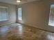 Comfortable bedroom featuring tile floors, natural light, and ceiling fan at 4027 Allure Ln, North Port, FL 34287