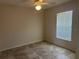 Bedroom with tile flooring, ceiling fan, and a window with blinds at 4027 Allure Ln, North Port, FL 34287
