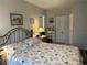 Inviting bedroom featuring a comfortable bed, soft lighting, and tasteful decor at 4027 Allure Ln, North Port, FL 34287