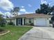 Charming single-story home featuring a well-maintained lawn, screened porch, and attached one-car garage at 4027 Allure Ln, North Port, FL 34287