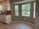 Bright eat-in nook with great natural light, tile floors, and white trim at 4027 Allure Ln, North Port, FL 34287