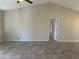 Open-concept living area boasting tile floors, vaulted ceilings, and neutral color palette at 4027 Allure Ln, North Port, FL 34287